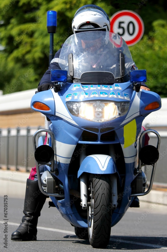Police motorcycle COP while patrolling the road and check motori Police motorcycle COP while patrolling the road and check motori