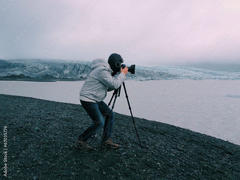 Photographer with a tripod in Skaftafell glacier, Iceland