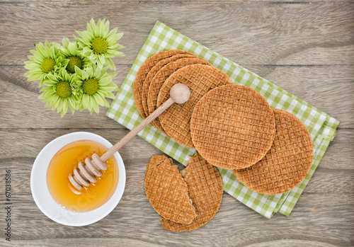 Dutch Waffles with honey on wooden background