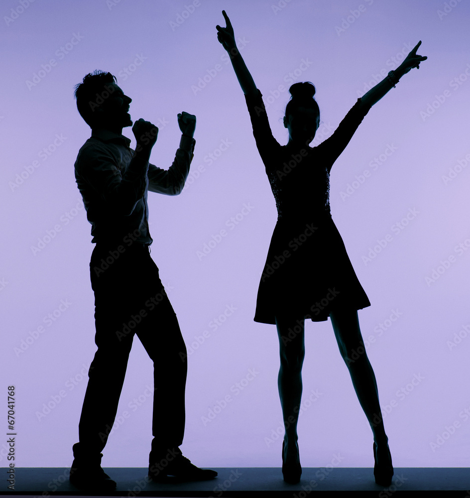 Joyful young couple dancing together Joyful young couple dancing together