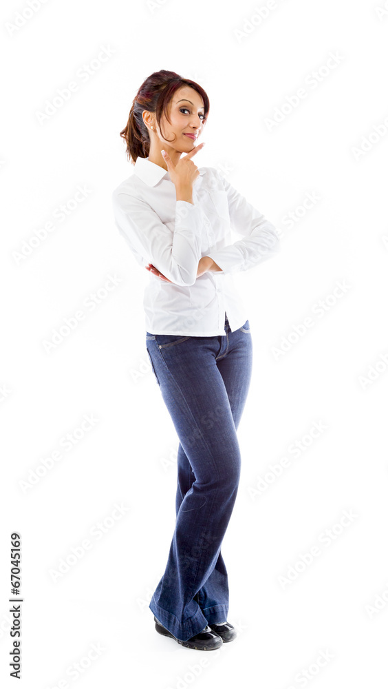Indian young woman standing with hand on chin Indian young woman standing with hand on chin
