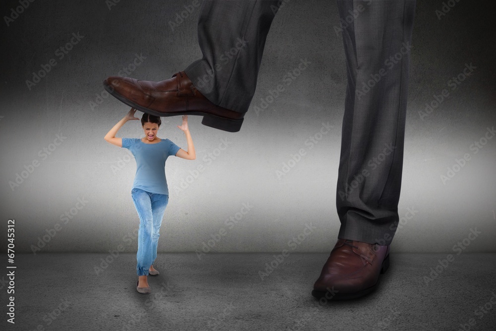 Fotografie Composite image of businessman stepping on girl