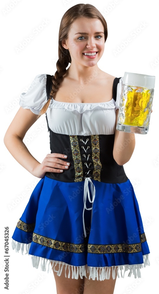 Pretty oktoberfest girl smiling at camera holding beer Pretty oktoberfest girl smiling at camera holding beer