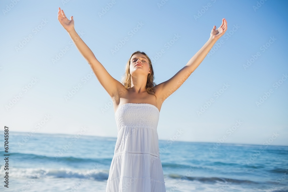 Beautiful blonde in white sundress on the beach Beautiful blonde in white sundress on the beach