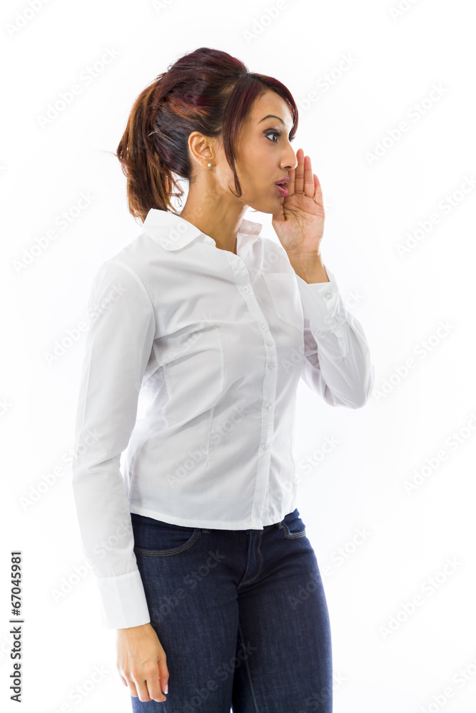 Indian young woman whispering message isolated on white Indian young woman whispering message isolated on white