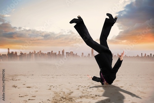 Принти на полотні Composite image of businesswoman burying her head