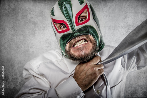 Office, aggressive executive suit and tie, Mexican wrestler mask photo