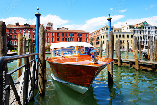 The parked water taxi for tourists transportation is on Grand Ca