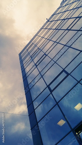 Modern office building glass wall and sky