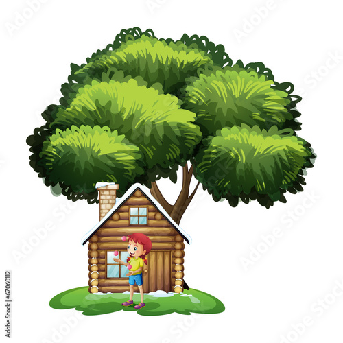 A house under the tree with a little girl playing