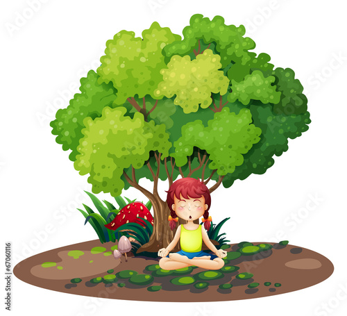 A girl doing yoga under the tree