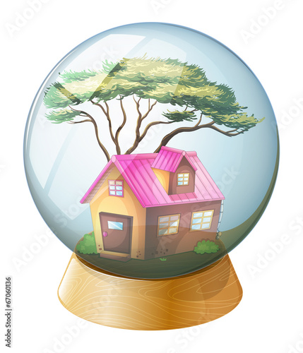 A crystal ball with a pink house inside