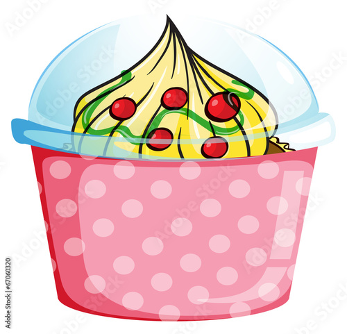 A cupcake inside a dotted pink container