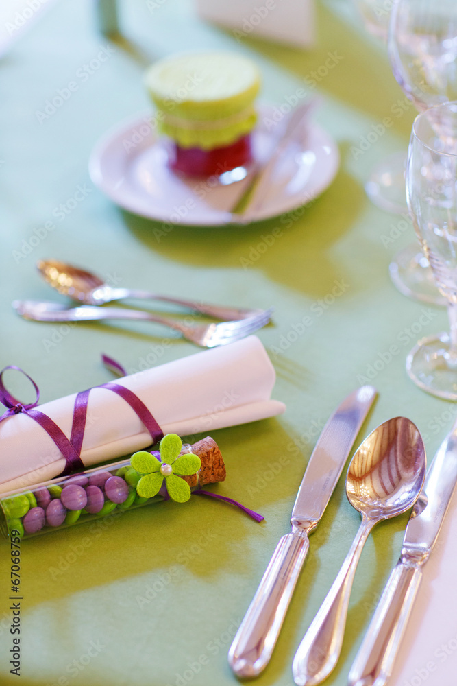 Elegant table set in lilac and green for wedding or event party Elegant table set in lilac and green for wedding or event party