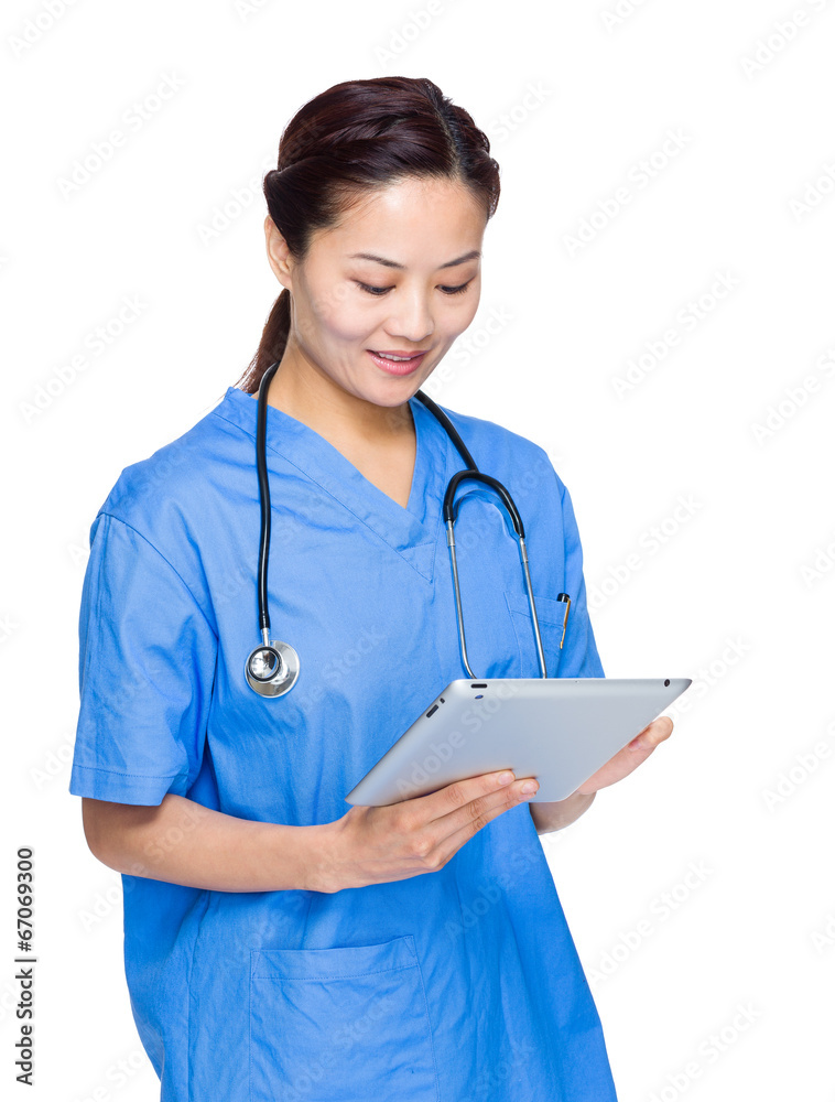 Asian doctor woman look at digital tablet Asian doctor woman look at digital tablet