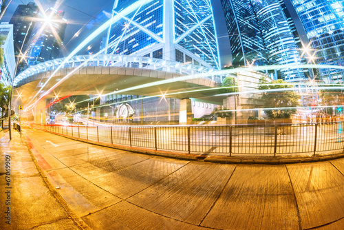 Photography the light trails on the modern building background in hongkong c