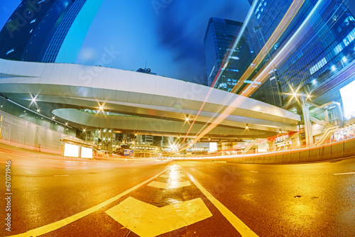 Photography the light trails on the modern building background in hongkong c
