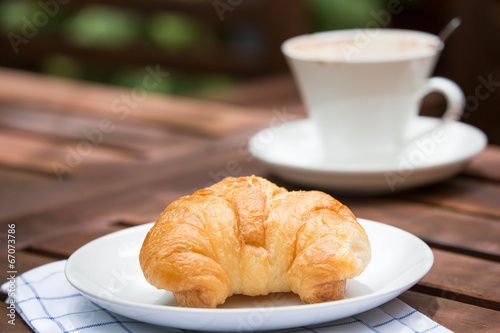 Fototapeta Naklejka Na Ścianę i Meble -  breakfast with croissants, cup of coffee