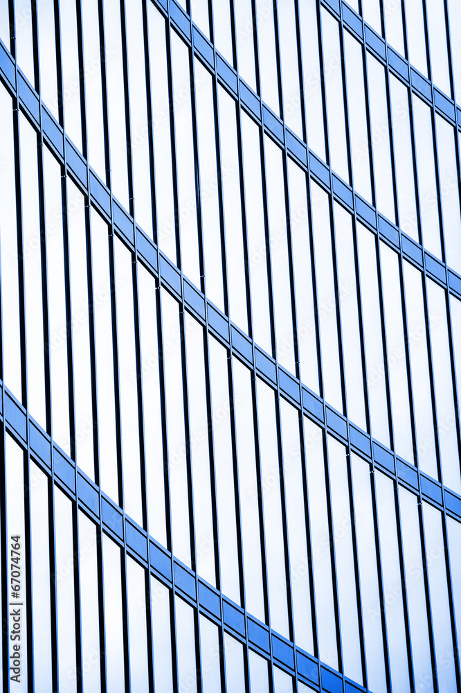 Glass facade of office building in sunset Glass facade of office building in sunset