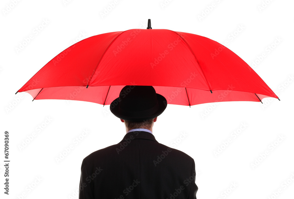 Businessman holding a red umbrella