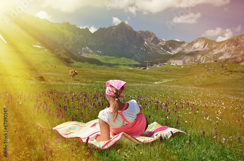 Girl in an Alpine meadow. Melchsee-Frutt, Switzerland