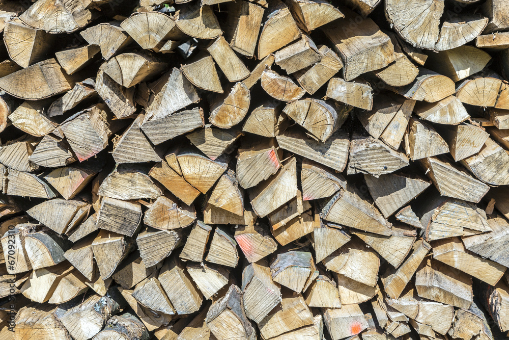 A lot of wooden piles. Stacked timber. A lot of wooden piles. Stacked timber.