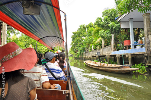 Tourists are sitting on the boat. photo