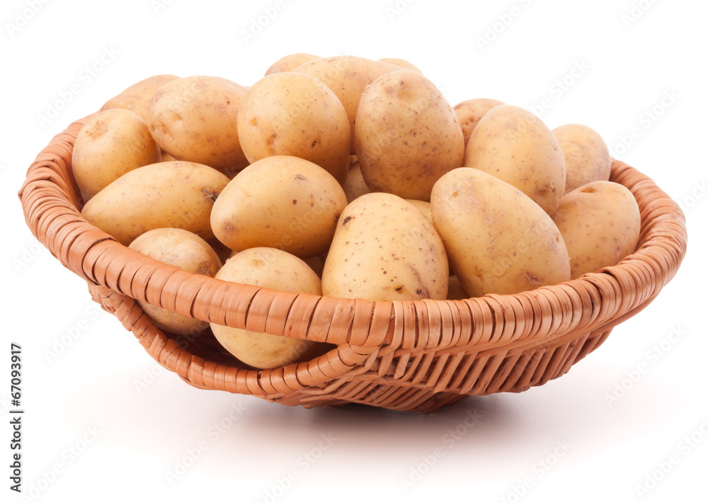 Potato tuber in wicker basket isolated on white background Potato tuber in wicker basket isolated on white background