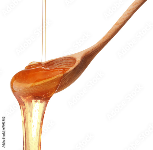 Wallpaper Mural Honey dripping from a wooden honey dipper isolated on white back Torontodigital.ca