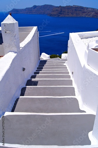 Classic white staircase towards the sea at Santorini, Greece