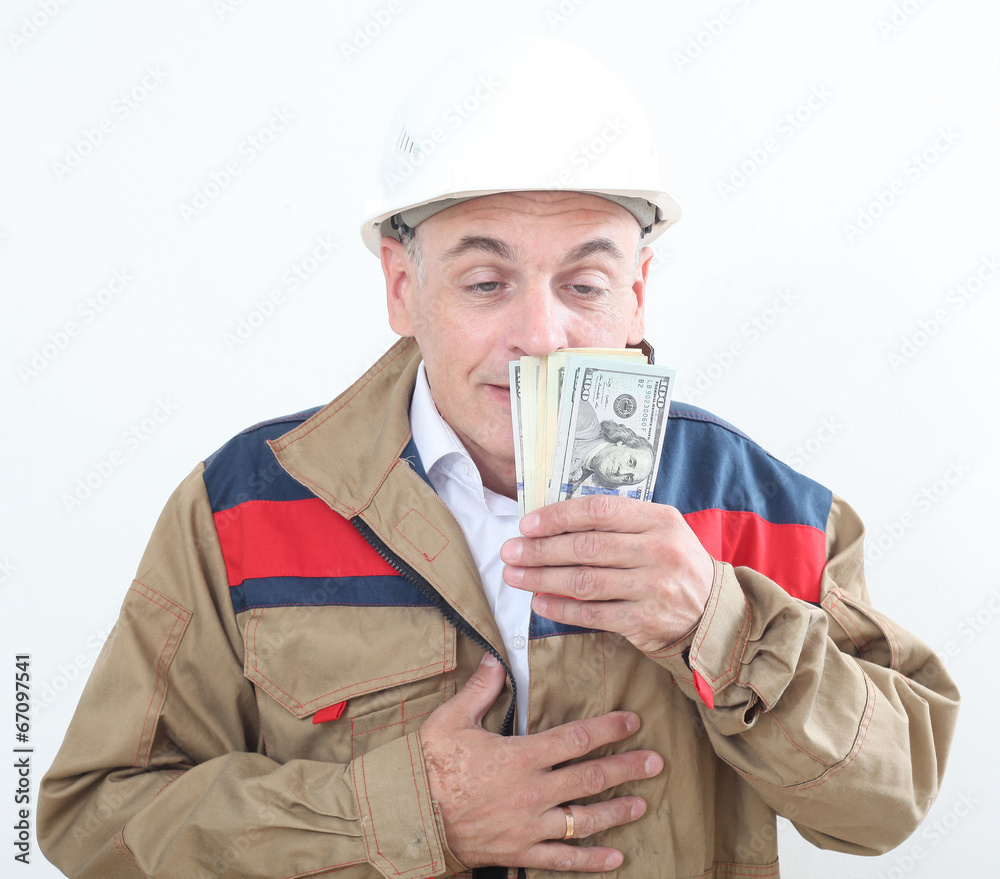 man in uniform with white construction helmet and holding money man in uniform with white construction helmet and holding money