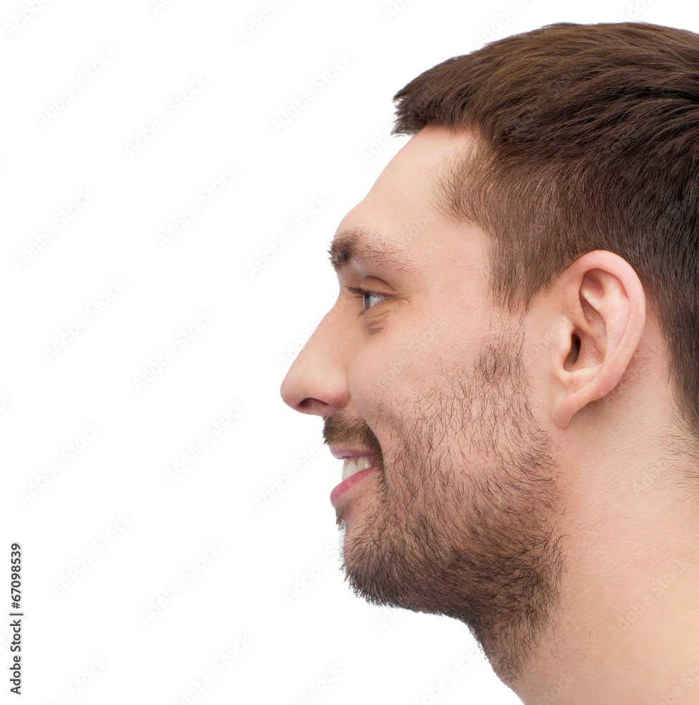 Obraz premium profile portrait of smiling young handsome man