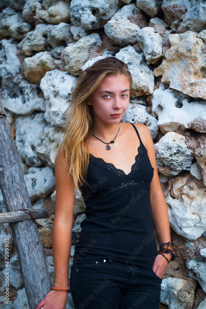 girl on the background of ancient masonry girl on the background of ancient masonry
