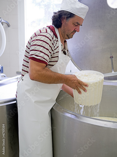 Artisan cheese making, rural craft. photo