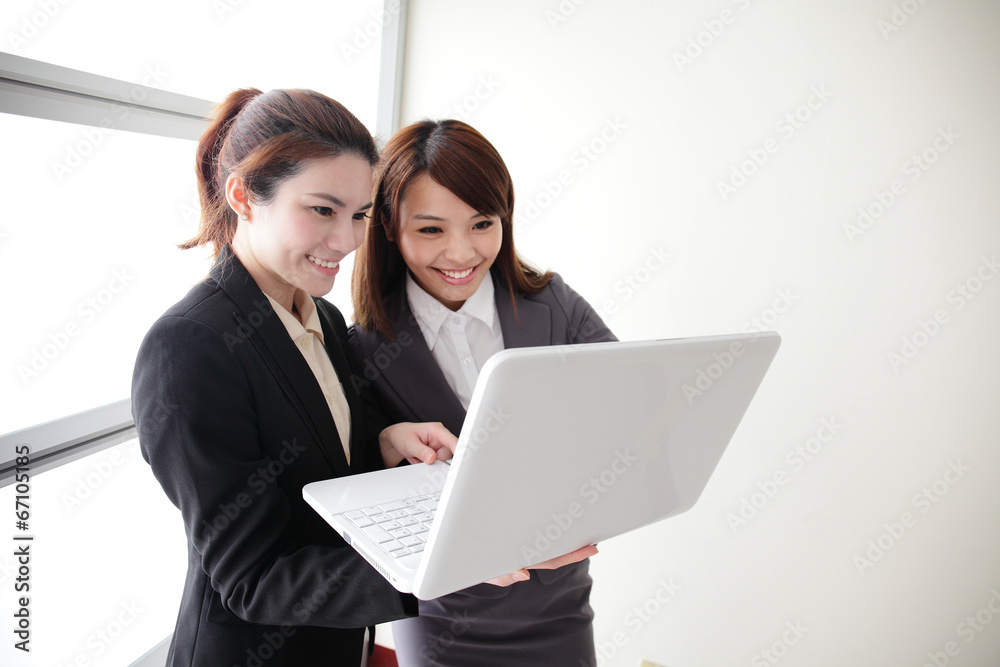 Business women look and smile conversation Business women look and smile conversation