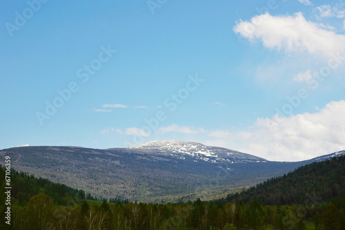 Beautiful alpine landscape with snow-covered mountain