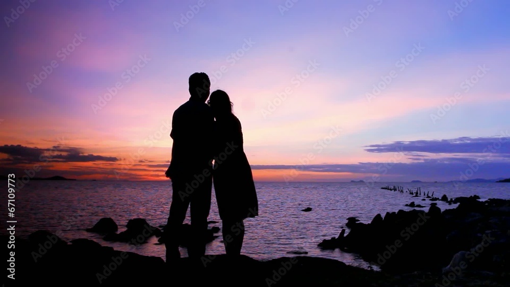 Silhouette couple in love taking self-portrait on the phone Silhouette couple in love taking self-portrait on the phone