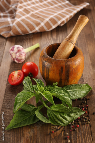 fresh basil, tomato, garlic, wooden mortar