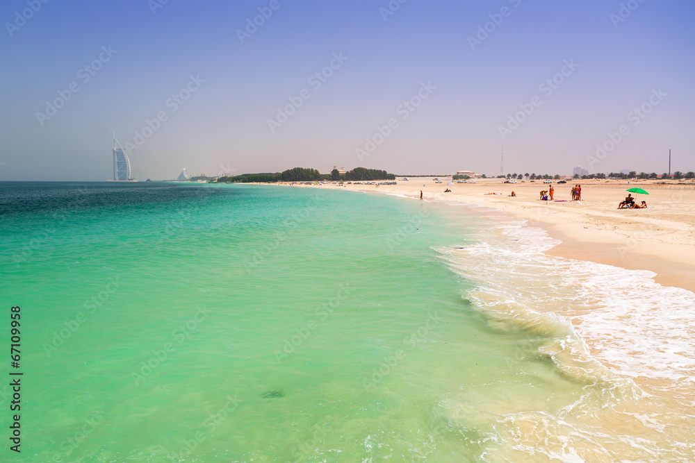 Public beach with turquoise water in Dubai, UAE