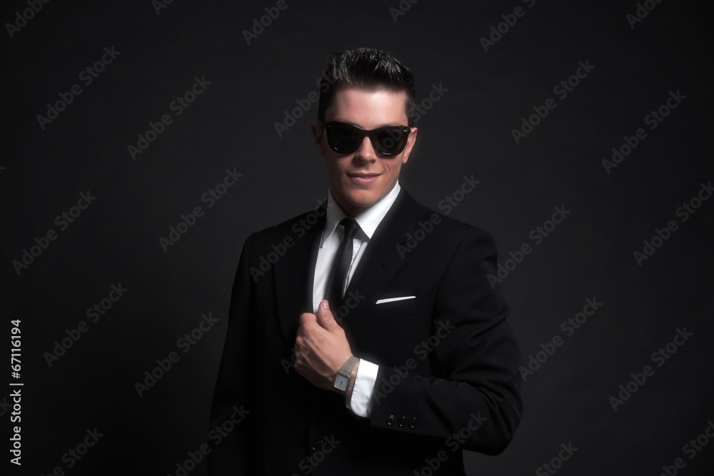 Retro fifties fashion man wearing black sunglasses with suit and Retro fifties fashion man wearing black sunglasses with suit and