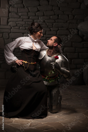 Knight giving a rose to lady