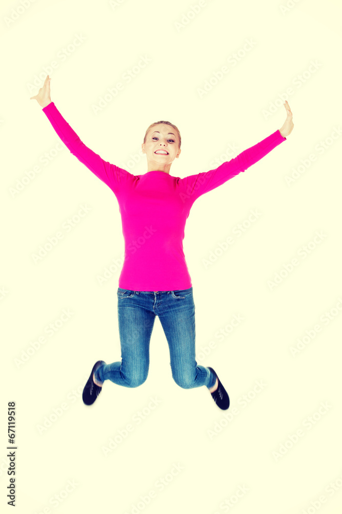 Young caucassian woman is jumping. Young caucassian woman is jumping.
