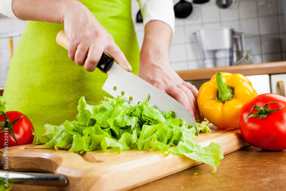 Woman's hands cutting vegetables Woman's hands cutting vegetables