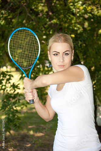 young woman playing tennis © dukibu