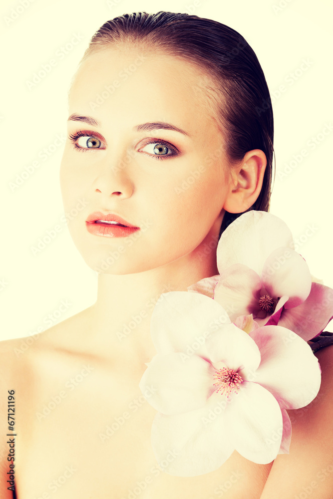 Woman with healthy clean skin and pink flowers Woman with healthy clean skin and pink flowers