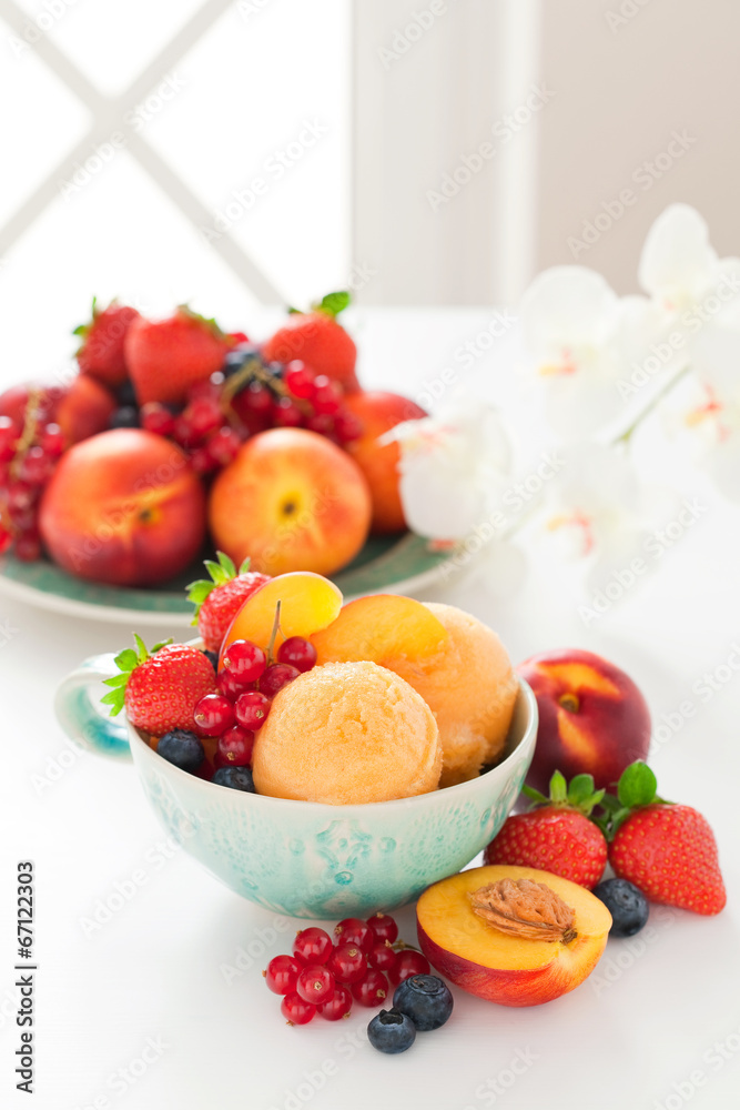 Peach sorbet and fresh berries, selective focus Peach sorbet and fresh berries, selective focus