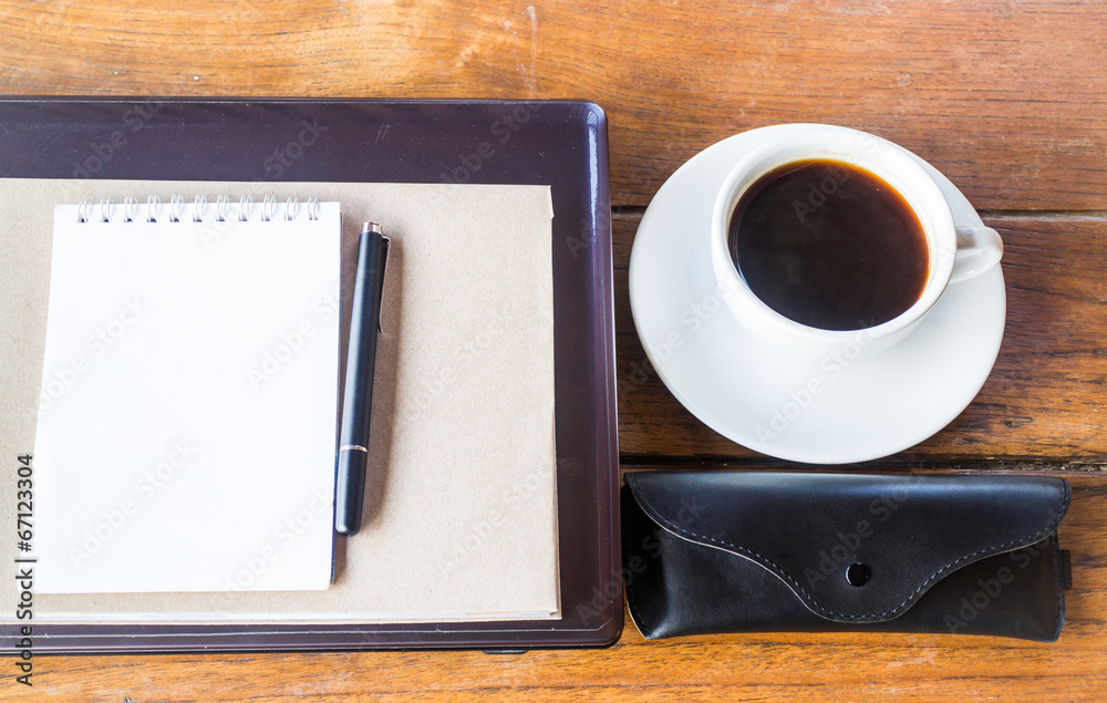 Simple work table with cup of coffee Simple work table with cup of coffee