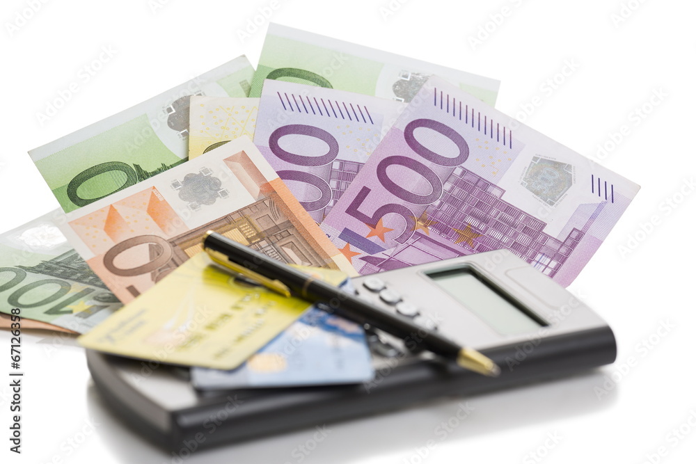 Banknotes, credit cards, calculator and pen Banknotes, credit cards, calculator and pen
