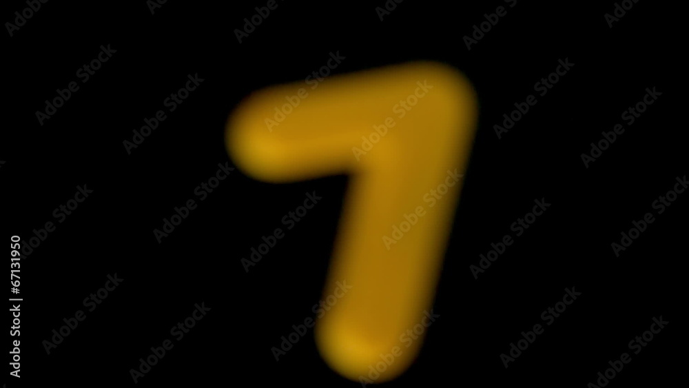 The number seven coming into focus on black background The number seven coming into focus on black background