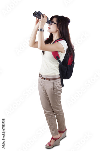 Female student using binocular